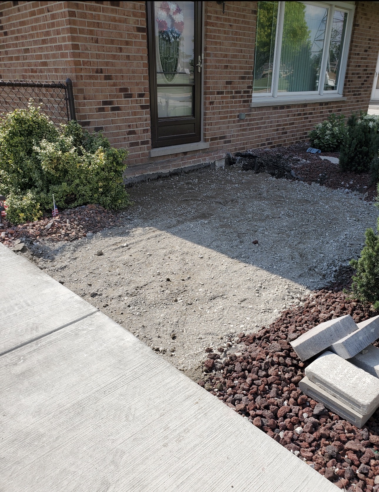 Prepared gravel and sand base where an old front stoop was removed